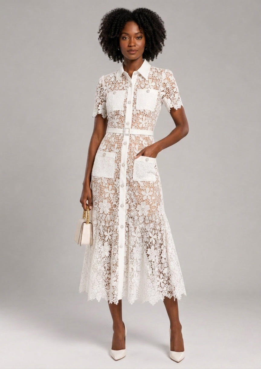 A woman modeling a white lace midi shirt dress with short sleeves, a button-up front, and front patch pockets against a light gray studio background.