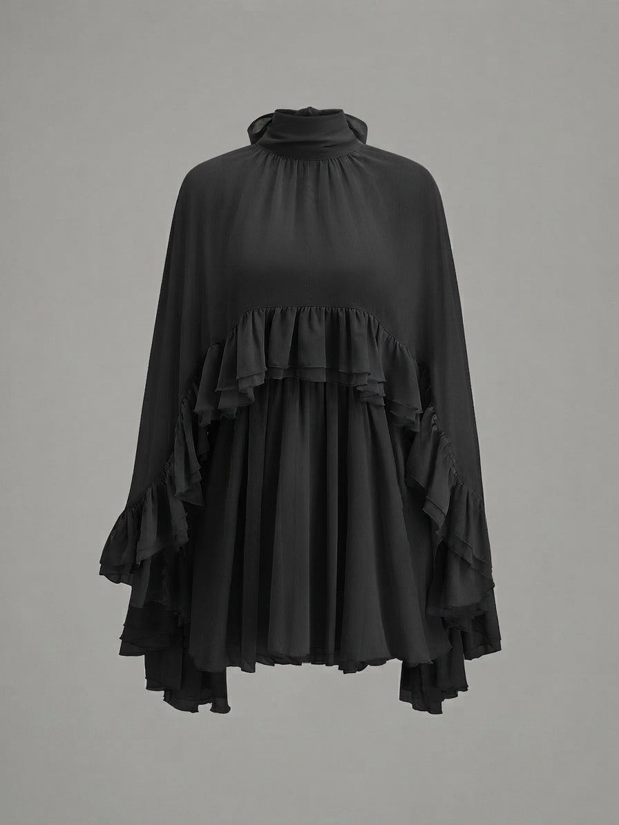 A black long-sleeve blouse with a high gathered mock neck, layered ruffle trim at the waist and cuffs, and a flowing silhouette, shown against a plain gray background.