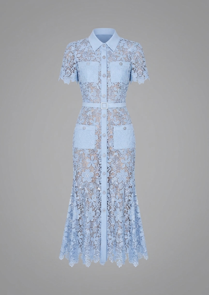 A light blue lace midi dress with a white collar, short sleeves, a matching waist tie, and two front patch pockets, shown against a solid gray background.
