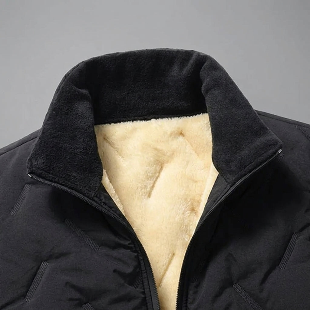 Close-up of a black winter jacket with a thick, plush cream-colored fleece lining visible inside the collar.