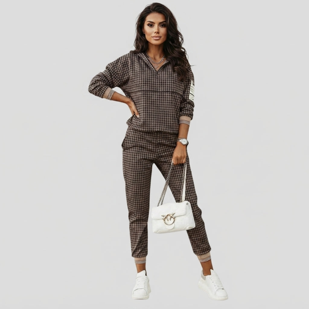 woman wearing a black and brown track suit