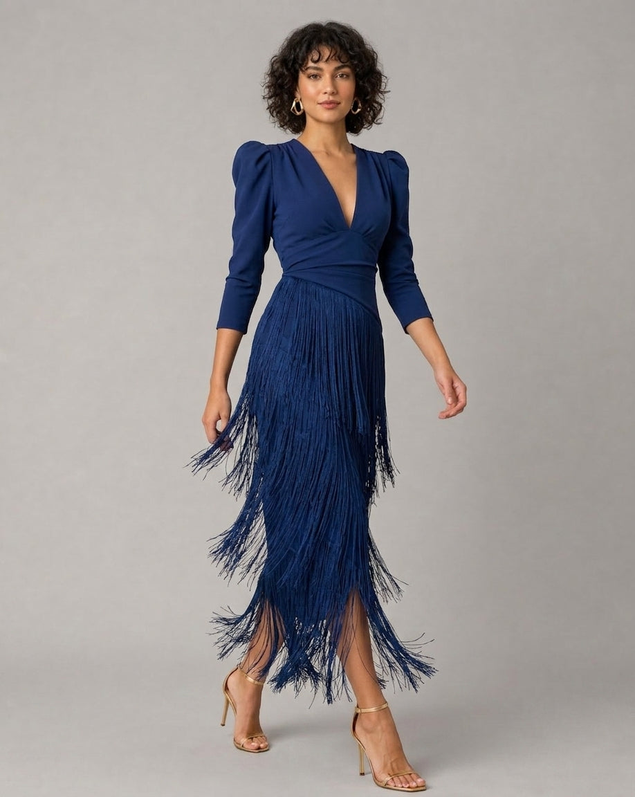 a woman wearing a blue dress with long tassles