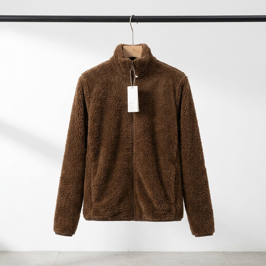 A brown sherpa fleece zip-up jacket hanging on a wooden hanger with a blank white tag, set against a clean white studio background.