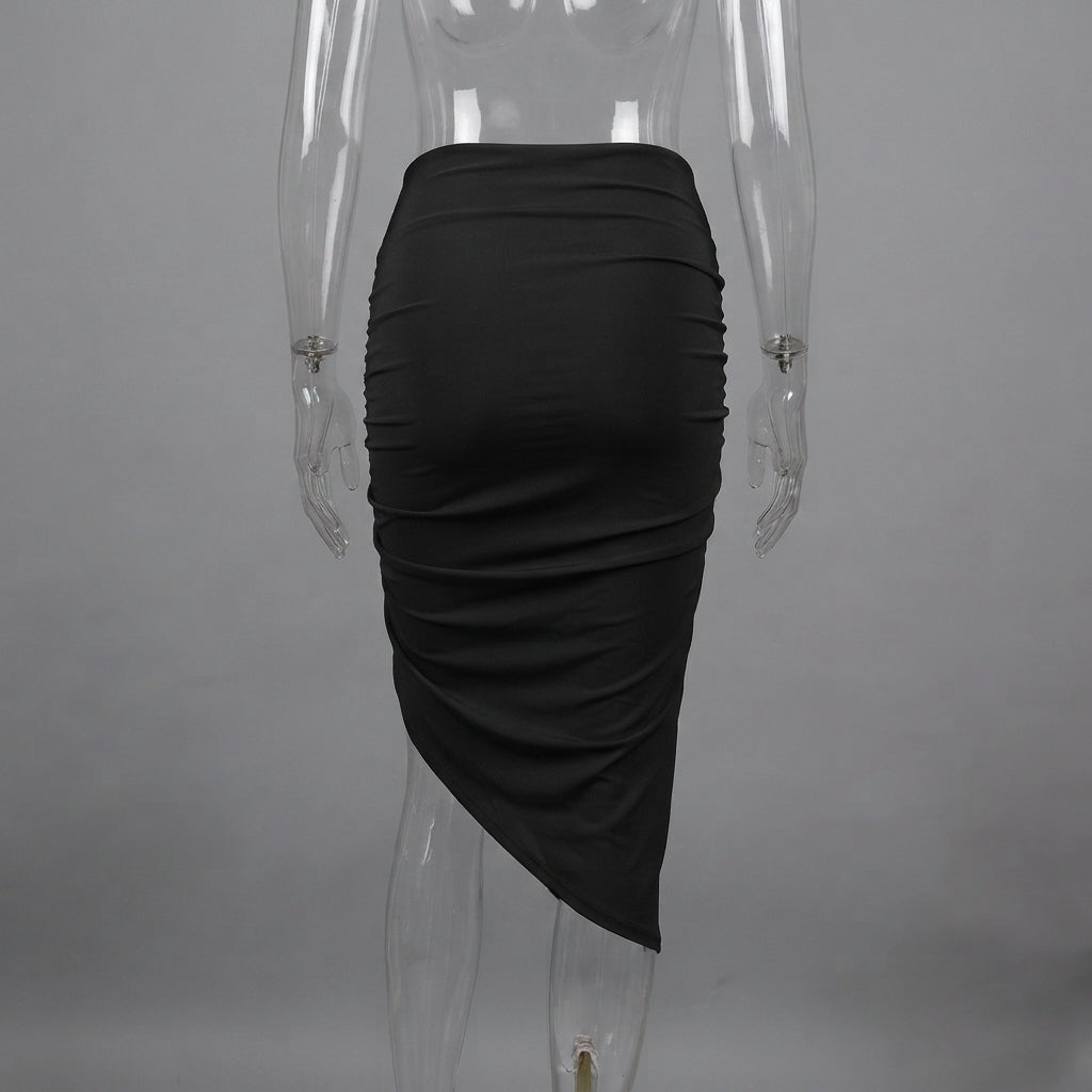 A black ruched asymmetrical skirt displayed on a clear mannequin against a gray studio background.