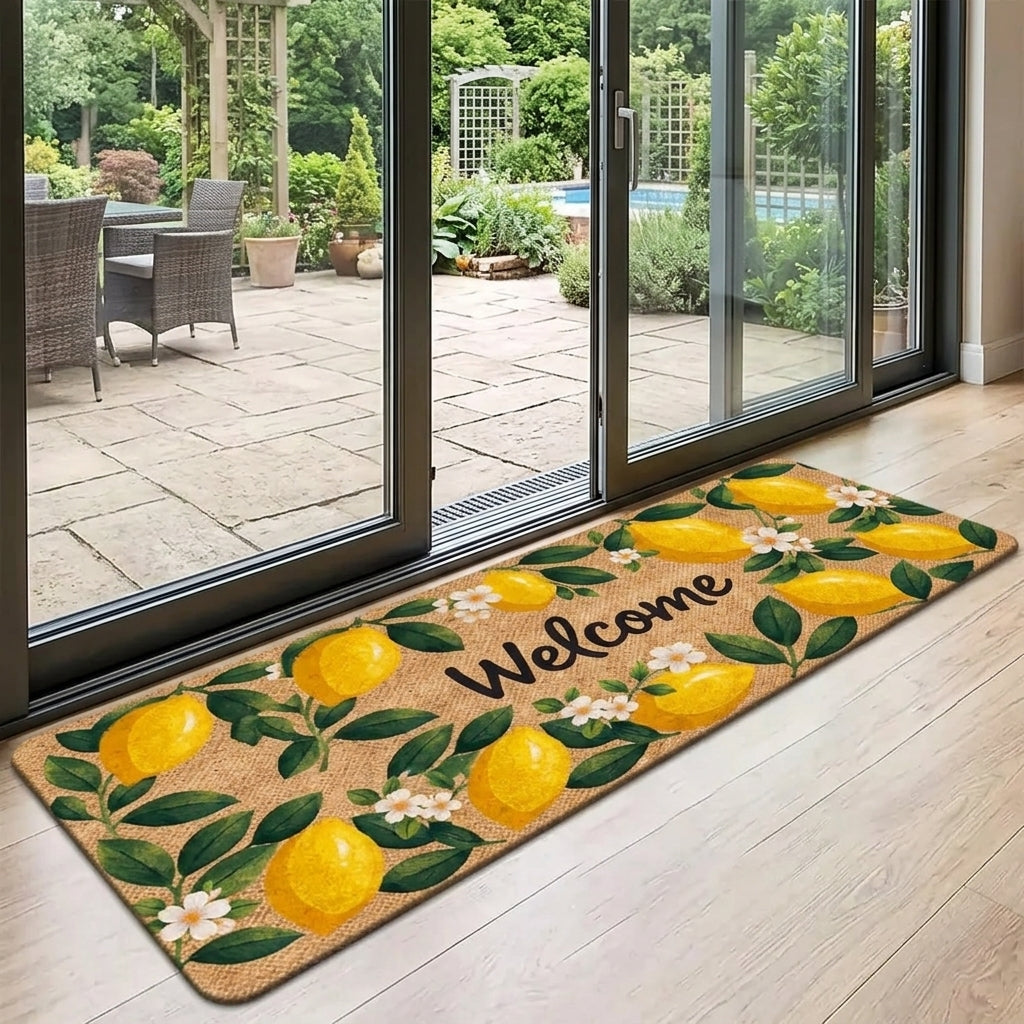 Decorative doormat with lemons and 'Welcome' text on a wooden floor, leading to a patio area.